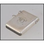 A silver hallmarked vesta case with monogram to centre.