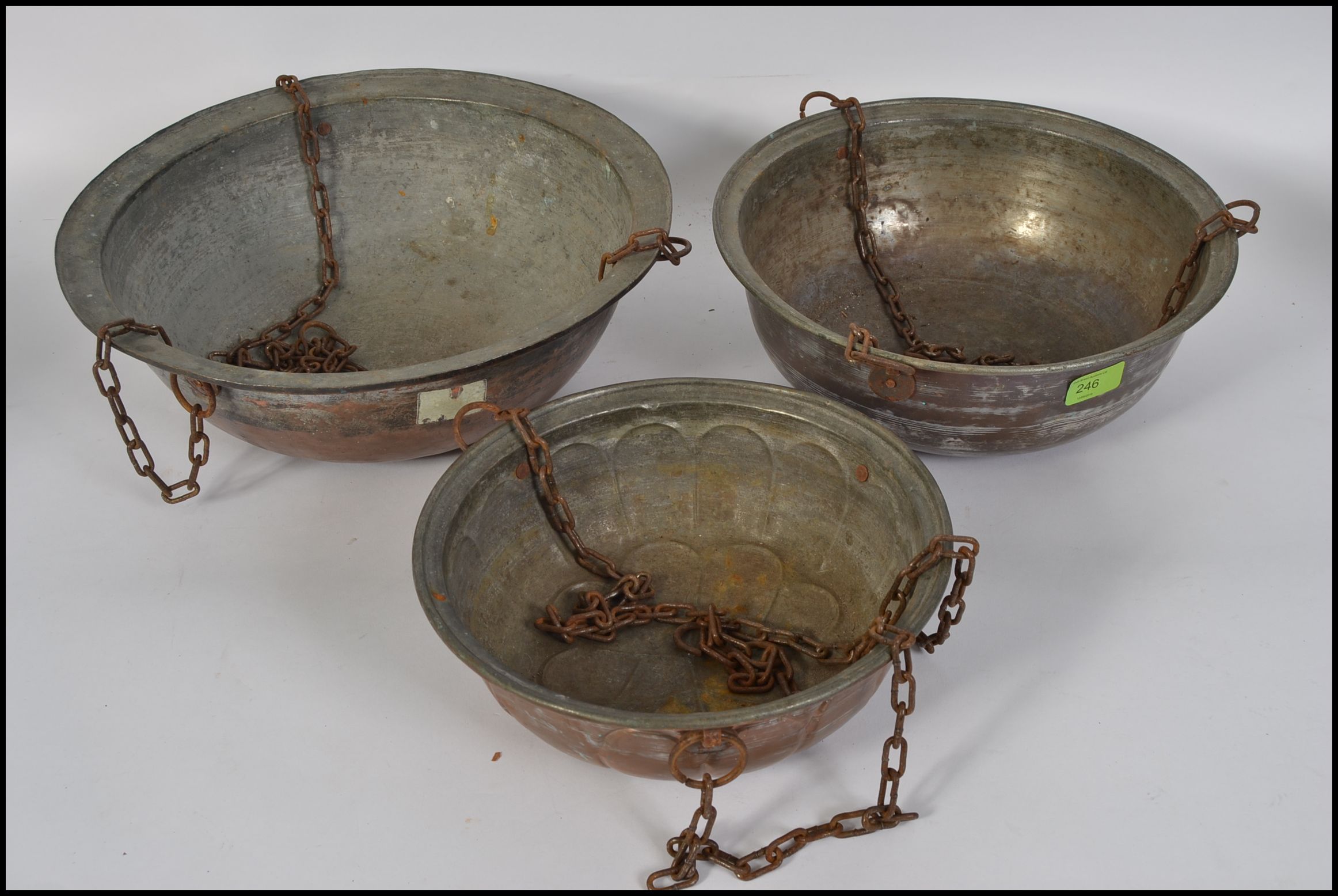 A set of 3 mid century garden hanging baskets with chains of copper construction,