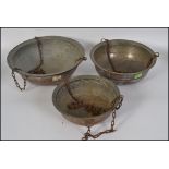 A set of 3 mid century garden hanging baskets with chains of copper construction,