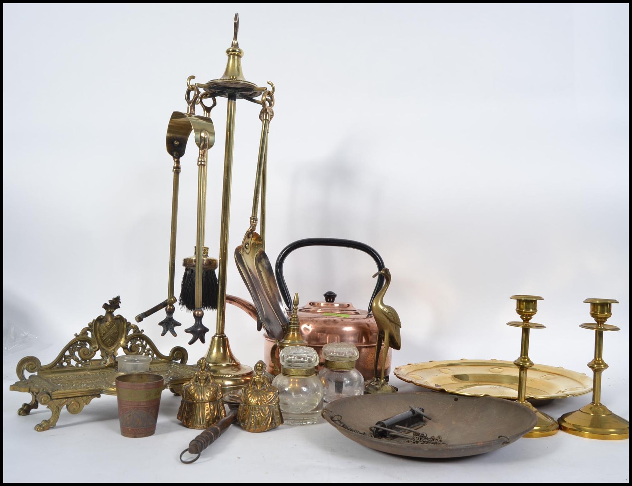 A good quality brass fireside compendium set, brass kettle, scales,