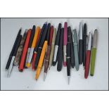 An old writing box containing a collection of Platinum and other vintage fountain pens and