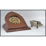 An early 20th century white metal vesta in the form of a pig with hinged head.