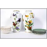 A pair of Franklin Mint vases by John Wilkinson entitled ' The Alpinee Butterfly Vase ' and the '