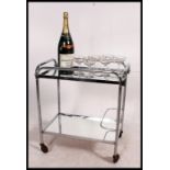 A 1930's Art Deco chrome and glass drinks trolley in the manner of Eileen Grey.