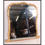 A 19th century large gilt plaster wood overmantel mirror having faux wood gilded finish with