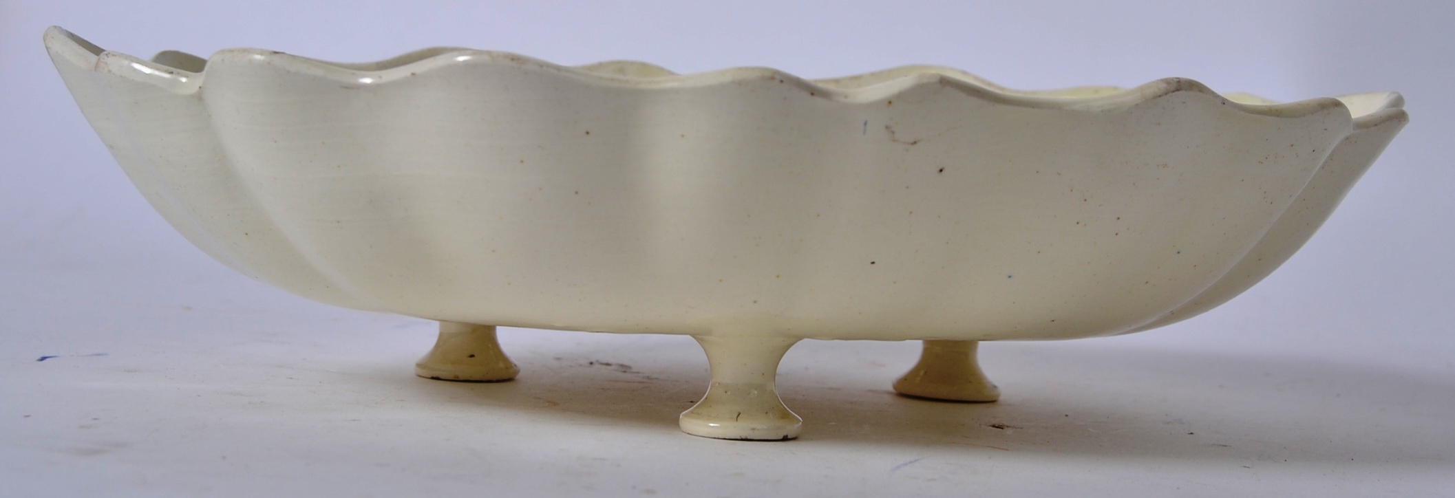 A Creamware Drainer Dish believed late 18th century of fluted oval form having nine foliate and - Image 4 of 5