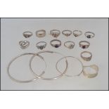 A collection of silver rings to include stone set, ying and yang, fret pierced, band ring,