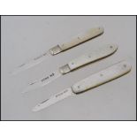 A collection of 3 silver mother of pearl hallmarked fruit knives - pen knives to include examples