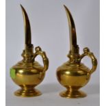 A pair of late 18th / early 19th century Indian long spouted temple oil ewers with anthropomorphic