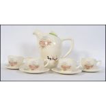 A retro Wedgwood Hyde Park tea service by Percy Lloyd comprising teapot, cups and saucers,