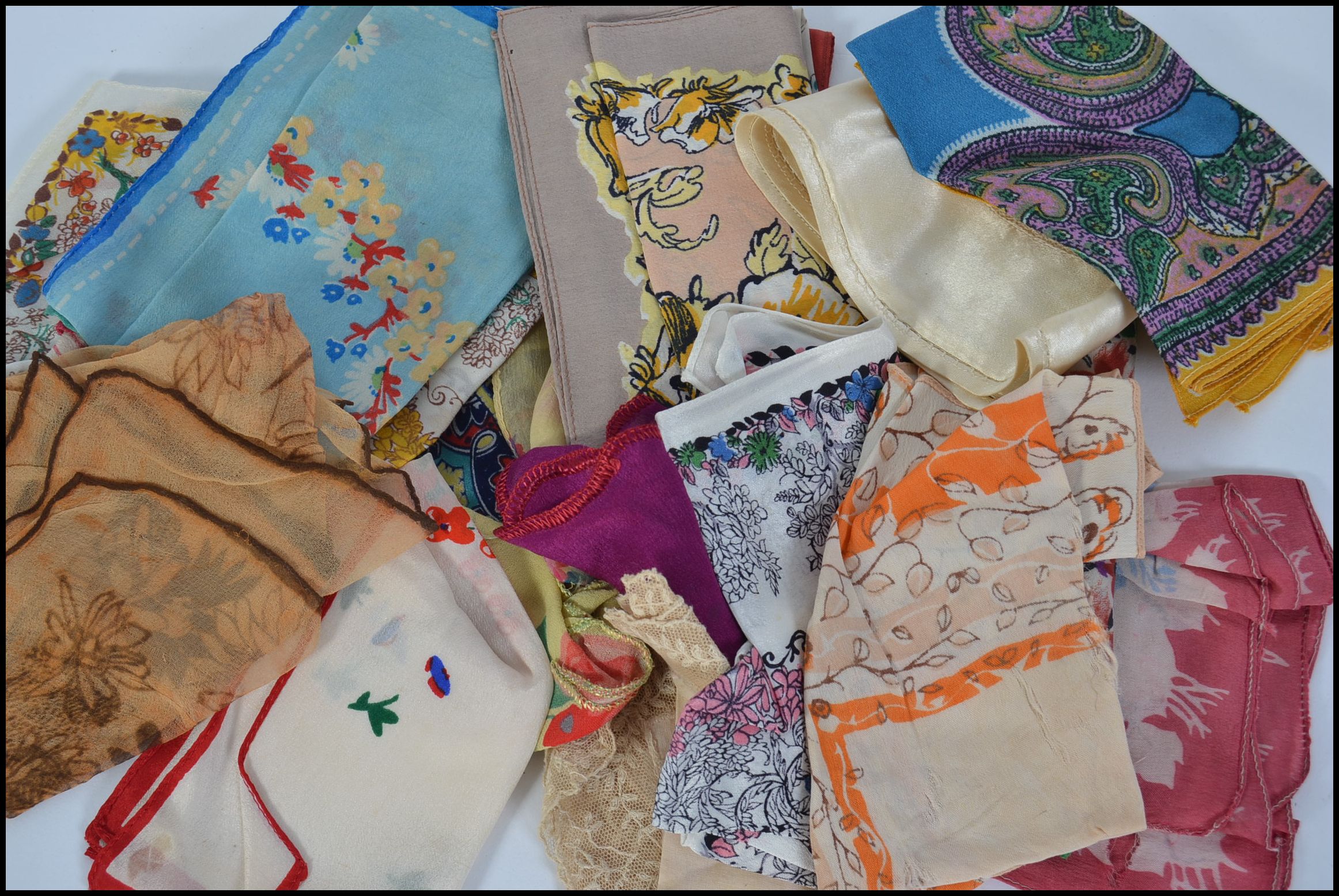 A mixed lot of ladies vintage handkerchiefs , some very pretty and detailed, some pure silk.