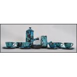 A fantastic retro studio pottery fat lava style coffee set having a lidded coffee pot, creamer,