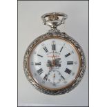 A beautiful large silver plated open faced pocket watch with répoussé case signed ' Frainier ' The