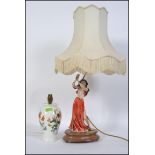 A 20th century Capodimonte lamp depicting a young lady with shade along with a Portmeirion Botanic