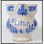 A small blue and white Delft / Faience apothecary jug,