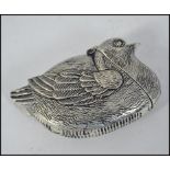 A silver plated vesta case in the form of a nesting bids having hinged end and striker to the base