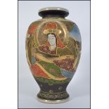 A 20th century Japanese Satsuma vase of baluster form with decorative all over patterns and scenes.