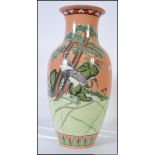 A fabulous large 20th century Chinese jar having tangerine background with cranes and foliates