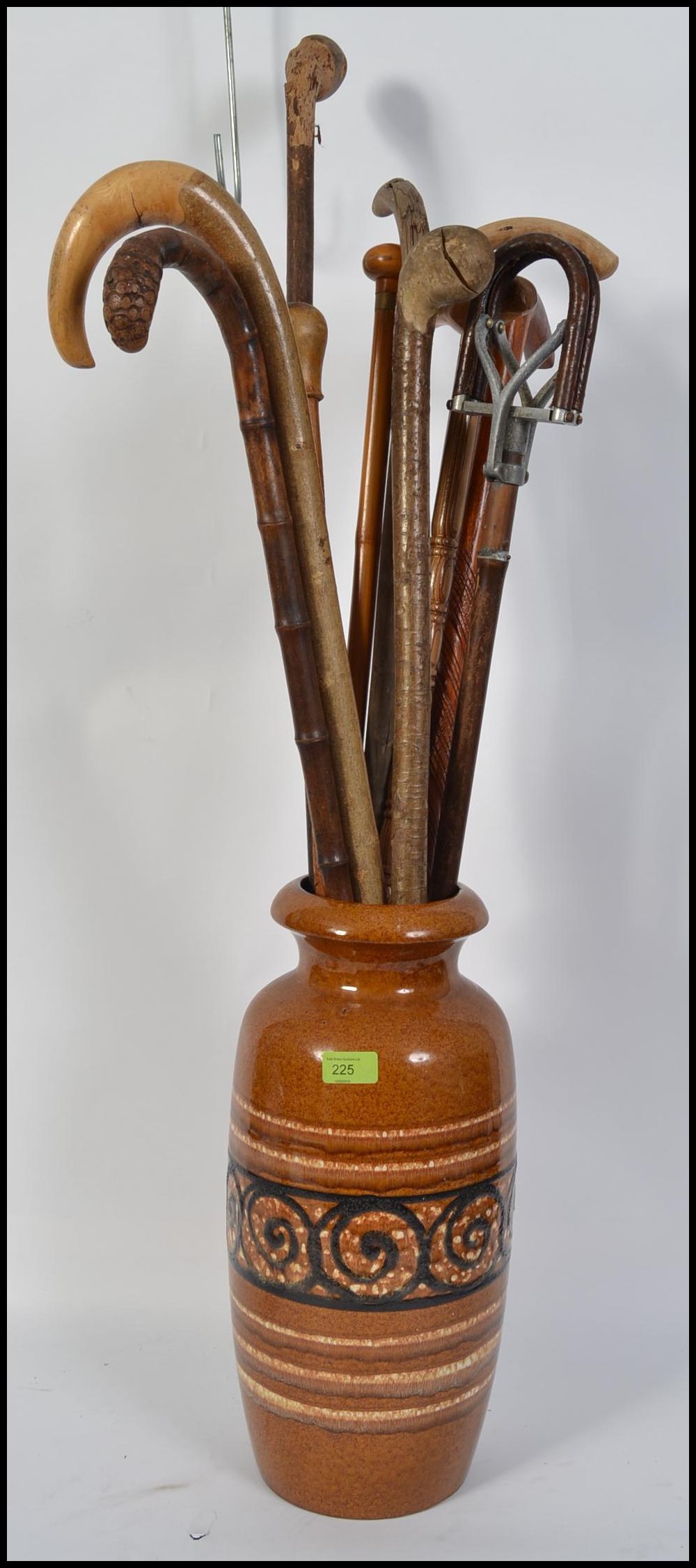 A retro 1970's West German stick stand / vase complete with a collection of walking sticks