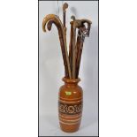 A retro 1970's West German stick stand / vase complete with a collection of walking sticks