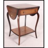 An Edwardian rosewood and marquetry inlaid drop leaf side / lamp table in the manner of Edwards &