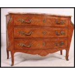 A 20th century French walnut and marble top bombe fronted commode chest of drawers.