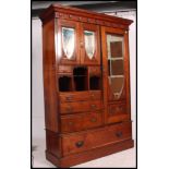 A Victorian mahogany arts & crafts compactum wardrobe.