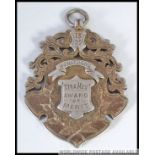 A silver and gilded Victorian cyclists medal dated 1899 being inscribed HJ Nathans Xtra Mex Award