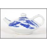A Chinese blue and white yi-xing teapot