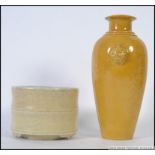 A Chinese monochrome yellow vase adorne