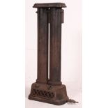 A Victorian cast Iron architectural heater radiator of double form raised on pedestal base.