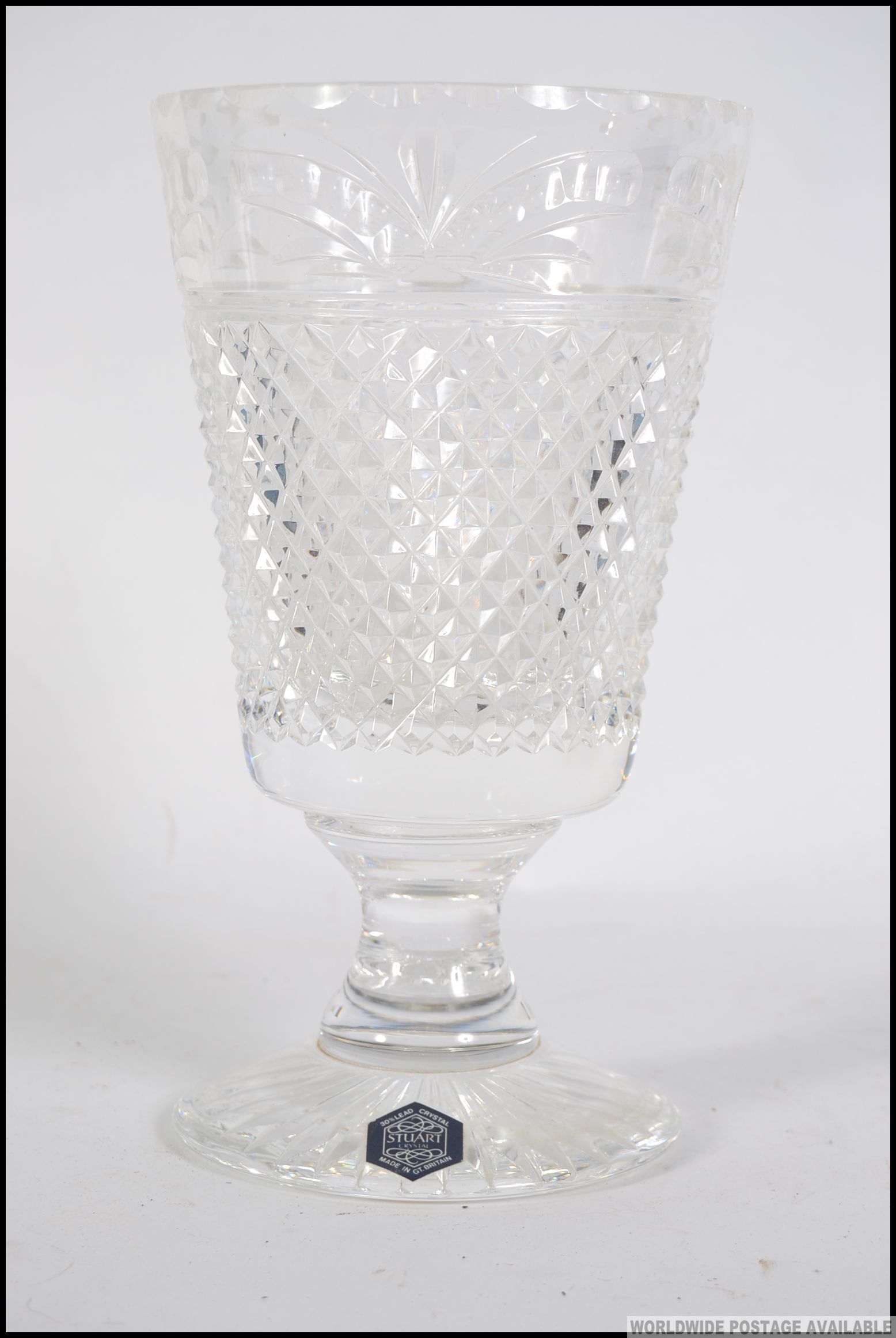A cut glass leaded Stuart crystal vase, having a cut glass geometric design please see images.