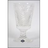 A cut glass leaded Stuart crystal vase, having a cut glass geometric design please see images.