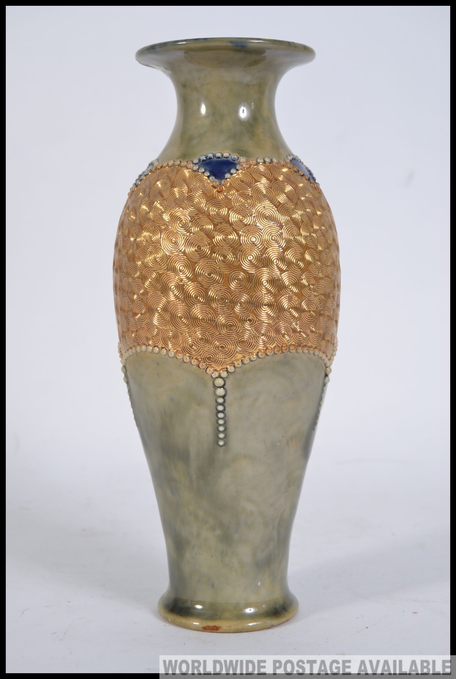 An early 20th century Doulton Lambeth stoneware glazed vase having blue rim with gilded finish