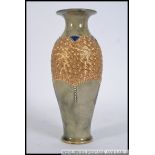 An early 20th century Doulton Lambeth stoneware glazed vase having blue rim with gilded finish