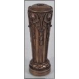 An unusual bronze seal in the form of a pillar inset with semi precious stones