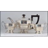 A silver hallmarked teapot with matching sugar bowl and creamer.