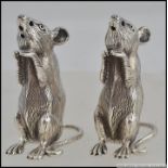 A pair of sterling silver condiments / cruet set in the form of mice,