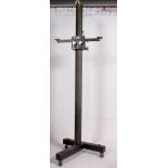 A large and unusual Industrial 20th century adjustable tripod camera stand on dolly wheel base.
