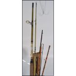 A collection of vintage fishing rods and fishing reels to include both fly and sea fishing rods and