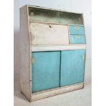 A retro 1950's two tone blue and white kitchen cabinet dresser having sliding glass cabinet,