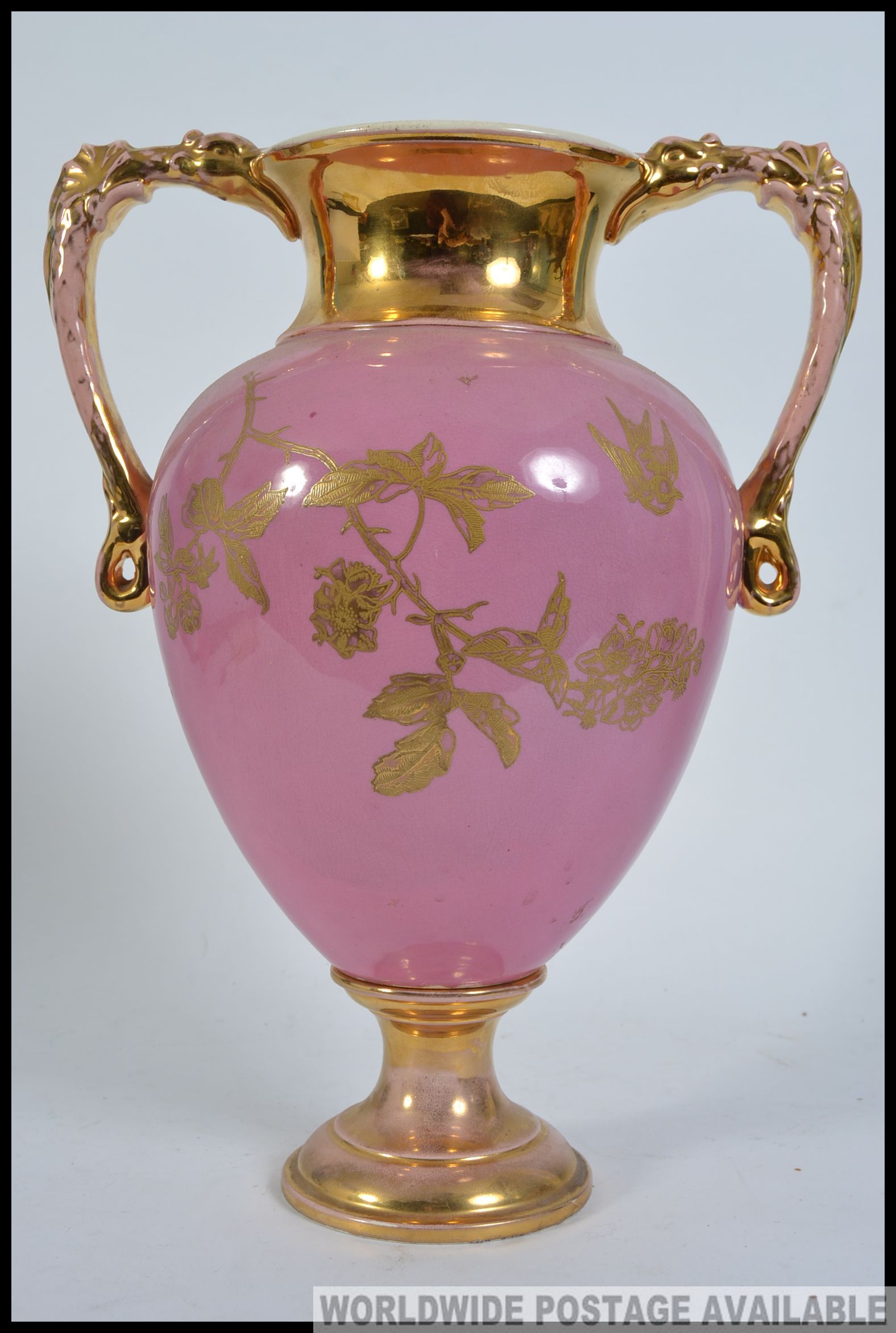 A large twin handled Victorian Staffordshire campana vase having pink ground with gilded details of - Image 4 of 4