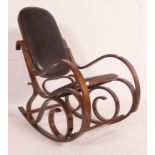 A retro bentwood Danish style patchwork leather rocking chair in the manner of Thonet having