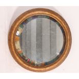 A 20th century up-cycled gilt framed wall mirror having an unusual mount to the mirror.