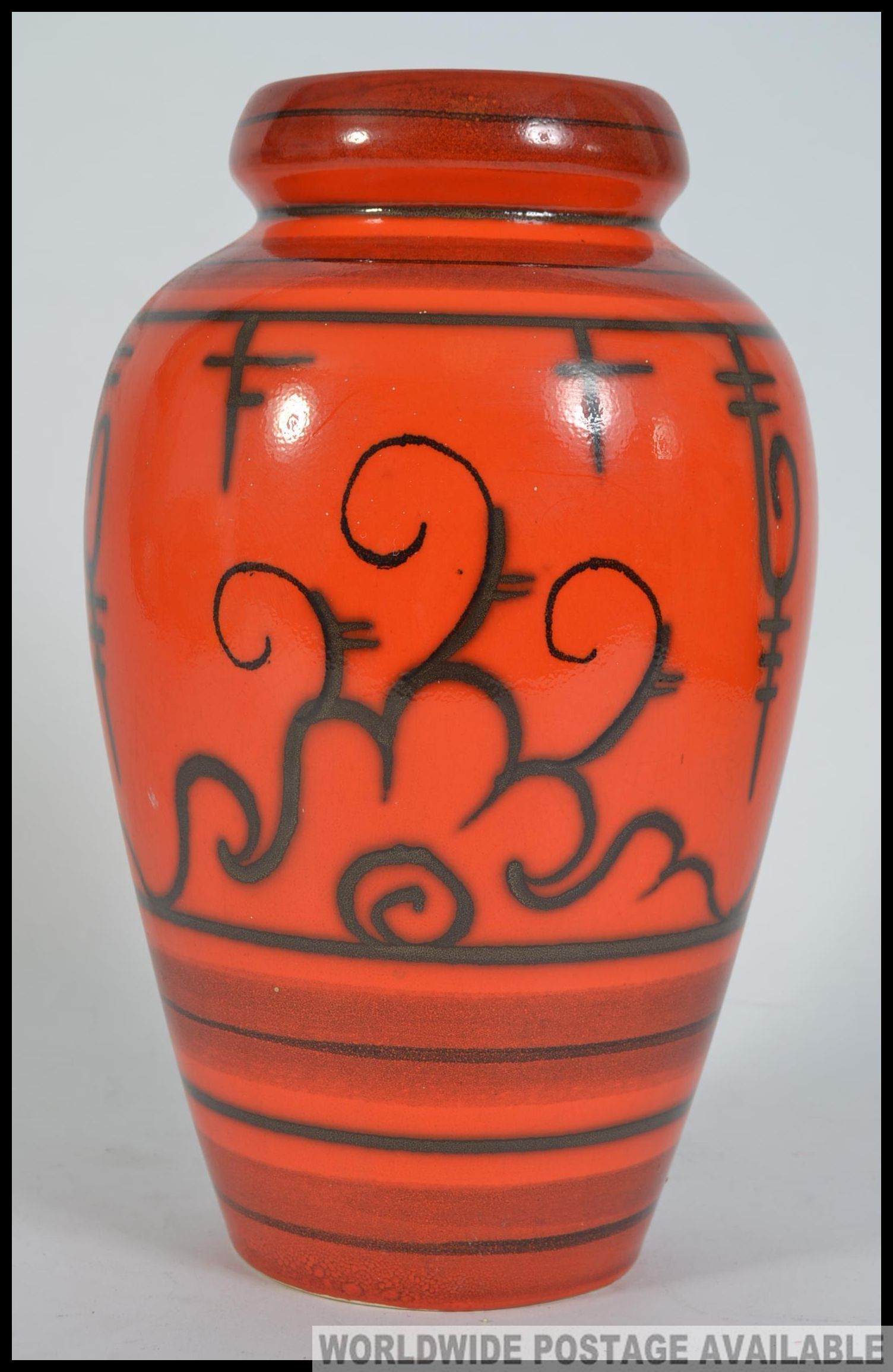 A 1970's retro orange ceramic Tokio Gouda Flora dutch vase bearing stamps to the base.