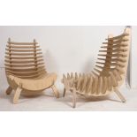 A pair of contemporary modular rib chairs of ply birch construction.