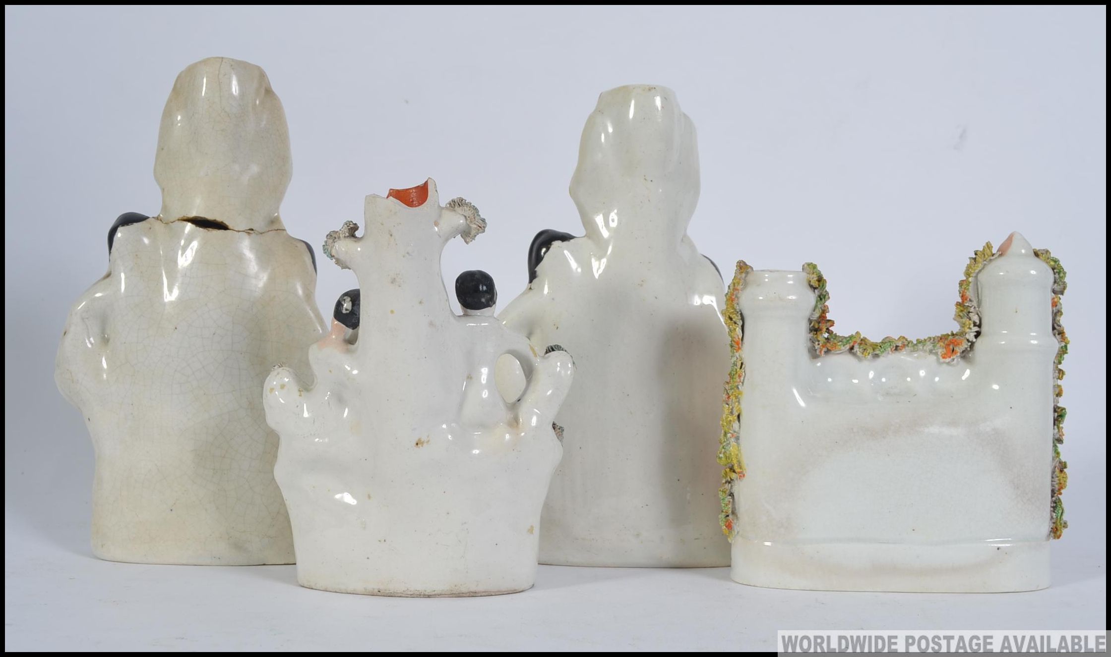 A pair of 19th century Staffordshire flatback ceramic candlesticks figurines along with two others. - Bild 2 aus 3