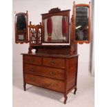 An Edwardian mahogany arts & crafts batwing dressing table chest of drawers.