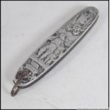 A silver white metal continental fruit / pen knife, heavily decorated with classical scenes.