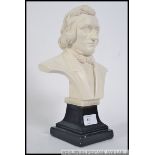 A 20th century plaster bust of Chopin being raised on a socle plinth base with notation.
